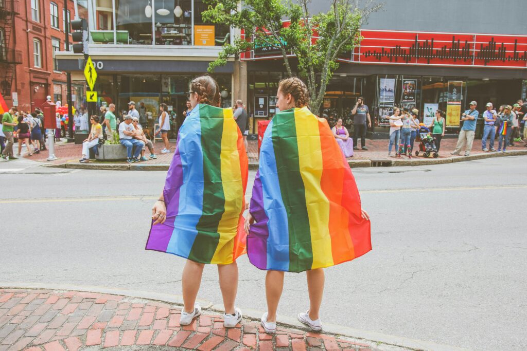 Couple wrapped in LGBT rainbow flags